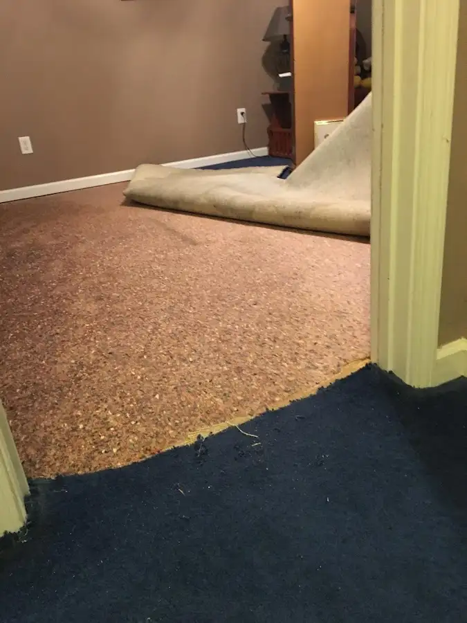 Carpet pad removal revealing water damage during Water Mitigation Services in Rio Vista